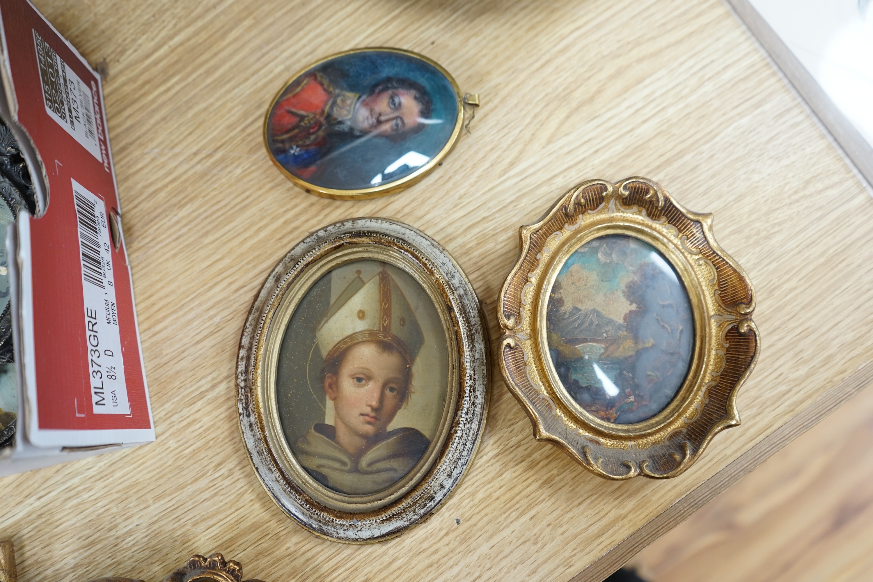 A collection of various hand painted and some printed miniatures to include an oil, Portrait of a bishop, landscapes and a portrait of a gentleman wearing military dress, largest 12 x 15cm, each housed in ornate frame. C